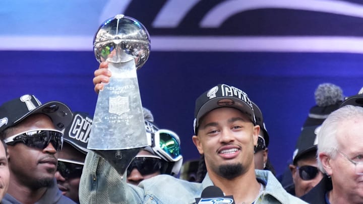 Seattle Seahawks wide receiver Jaxon Smith-Njigba holds the Vince Lombardi trophy. Seattle Seahawks wide receiver Jaxon Smith-Njigba holds the Vince Lombardi trophy.