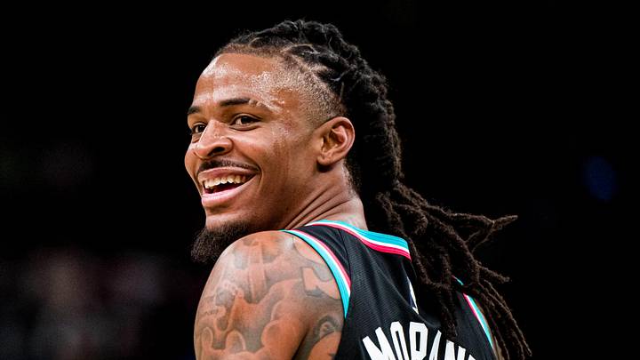 Dec 12, 2025; Memphis, Tennessee, USA; Memphis Grizzlies point guard Ja Morant (12) smiles at the Utah Jazz bench after forcing a turnover in the second half at FedExForum. Mandatory Credit: Matthew Smith-Imagn Images