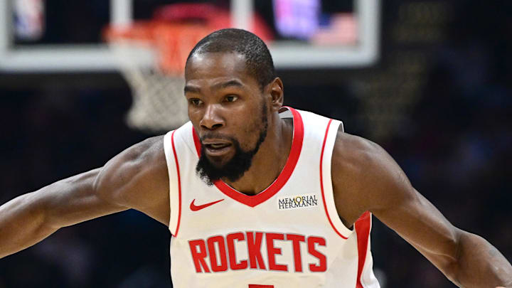 Nov 19, 2025; Cleveland, Ohio, USA; Houston Rockets forward Kevin Durant (7) drives on Cleveland Cavaliers forward De'Andre Hunter (12) during the first half at Rocket Arena. Mandatory Credit: David Dermer-Imagn Images