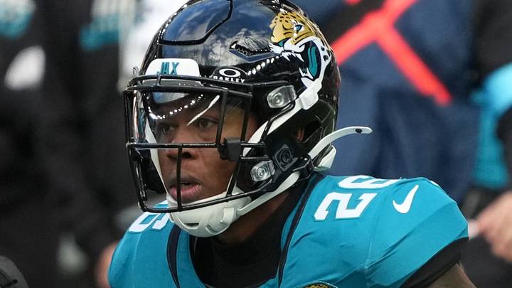 Oct 11, 2026; Tottenham, ENG; Philadelphia Eagles wide receiver Dontayvion Wicks (13) signals a first down after being tackled by Jacksonville Jaguars cornerback Jarrian Jones (4) and safety Kaevon Merriweather (26) at Tottenham Hotspur Stadium. Oct 11, 2026; Tottenham, ENG; Philadelphia Eagles wide receiver Dontayvion Wicks (13) signals a first down after being tackled by Jacksonville Jaguars cornerback Jarrian Jones (4) and safety Kaevon Merriweather (26) at Tottenham Hotspur Stadium.
