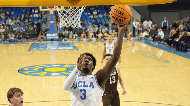 Nov 15, 2024; Los Angeles, California, USA; UCLA Bruins guard Eric Dailey Jr. (3) shoots the ball against Lehigh Mountain Hawks forward Hank Alvey (35) in the first half at Pauley Pavilion presented by Wescom. Mandatory Credit: Kirby Lee-Imagn Images