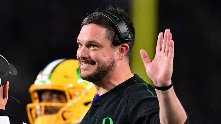 Oct 18, 2024; West Lafayette, Indiana, USA; Oregon Ducks head coach Dan Lanning holds his hand up and smiles while talking to a referee during the first quarter at Ross-Ade Stadium. Mandatory Credit: Marc Lebryk-Imagn Images Oct 18, 2024; West Lafayette, Indiana, USA; Oregon Ducks head coach Dan Lanning holds his hand up and smiles while talking to a referee during the first quarter at Ross-Ade Stadium. Mandatory Credit: Marc Lebryk-Imagn Images