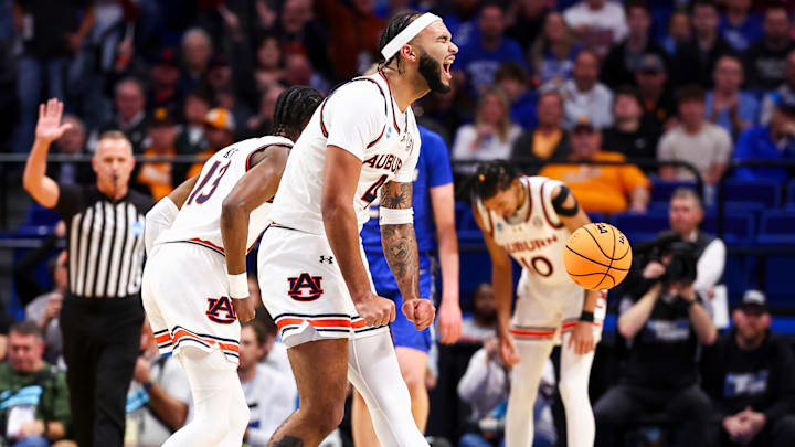 Johni Broome celebrates during the NCAA Tournament Second Round game between the Auburn Tigers and the Creighton Bluejays Johni Broome celebrates during the NCAA Tournament Second Round game between the Auburn Tigers and the Creighton Bluejays