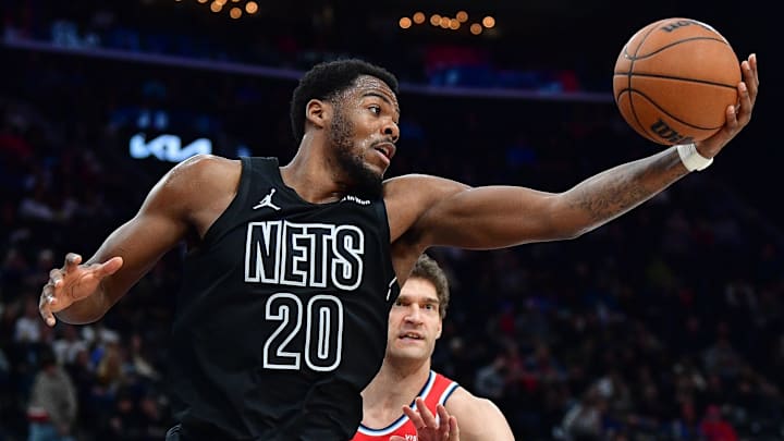 Jan 25, 2026; Inglewood, California, USA; Brooklyn Nets center Day'ron Sharpe (20) gets the rebound against Los Angeles Clippers center Brook Lopez (11) during the second half at Intuit Dome. Mandatory Credit: Gary A. Vasquez-Imagn Images