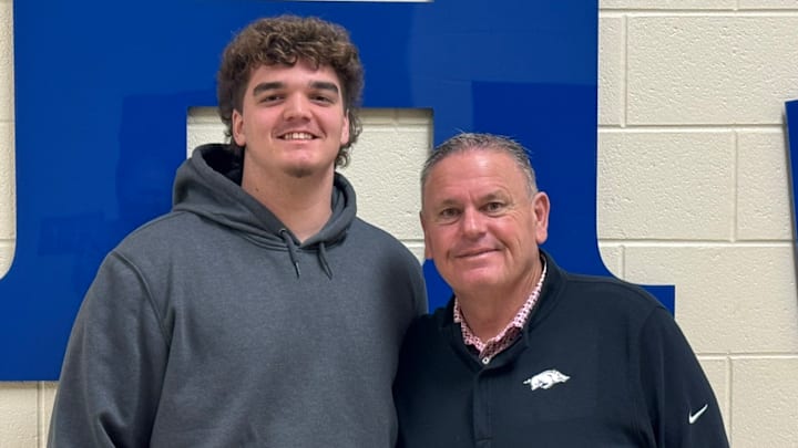 Cass High School offensive lineman Bear McWhorter entertains Arkansas Razorbacks coach Sam Pittman during recent school visit Jan. 22, 2025