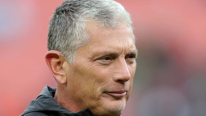Former Cleveland Browns defensive coordinator Jim Schwartz watches the team warm up before an NFL football game Former Cleveland Browns defensive coordinator Jim Schwartz watches the team warm up before an NFL football game