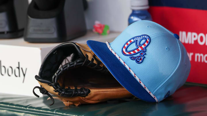 Jul 4, 2025; Atlanta, Georgia, USA; A detailed view of the Baltimore Orioles 4th of July hat in the dugout against the Atlanta Braves in the third inning at Truist Park. 
