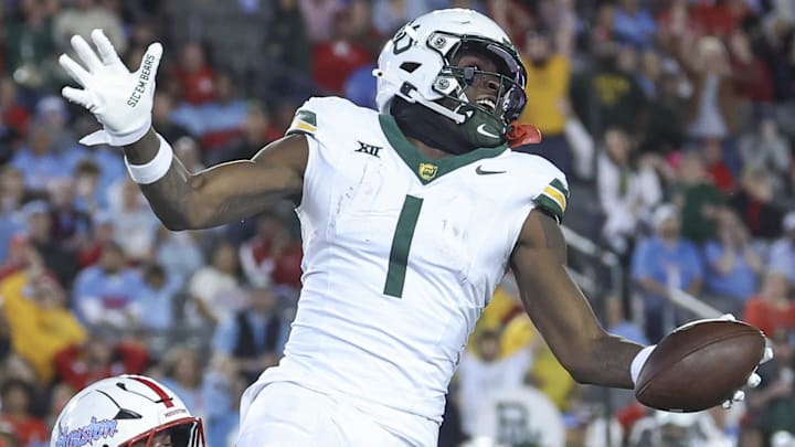  Baylor Bears tight end Michael Trigg runs with the ball after a reception against the Houston Cougars.