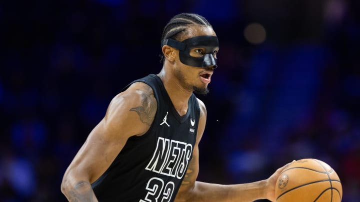 Apr 14, 2024; Philadelphia, Pennsylvania, USA; Brooklyn Nets center Nic Claxton (33) dribbles the ball against the Philadelphia 76ers during the first quarter at Wells Fargo Center. Mandatory Credit: Bill Streicher-USA TODAY Sports