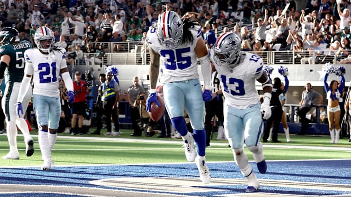 Dallas Cowboys linebacker Marist Liufau and linebacker DeMarvion Overshown react to recovering a fumble in the second quarter against the Philadelphia Eagles.