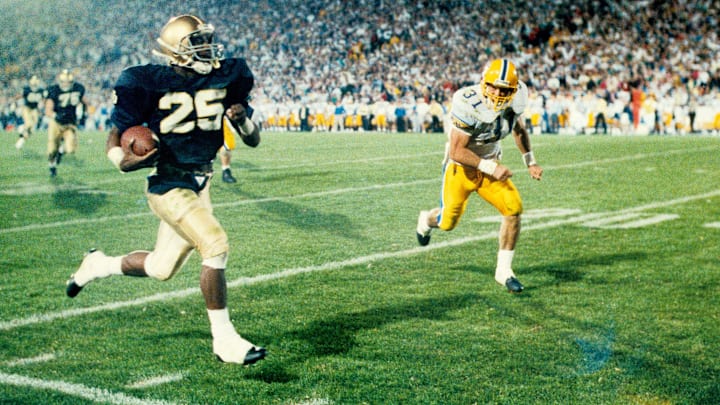 Oct 28, 1989; South Bend, IN, USA; FILE PHOTO; Notre Dame Irish receiver Raghib Ismail (25) returns a punt for a touchdown against the Pittsburgh Panthers at Notre Dame Stadium.