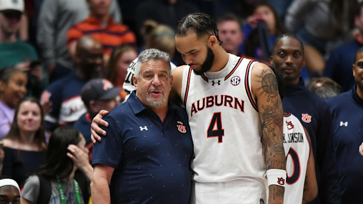 Auburn Tigers forward Johni Broome embraces head coach Bruce Pearl Auburn Tigers forward Johni Broome embraces head coach Bruce Pearl