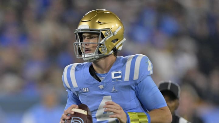Nov 8, 2024; Pasadena, California, USA;   UCLA Bruins quarterback Ethan Garbers (4) looks to pass in the first half against the Iowa Hawkeyes at the Rose Bowl. Mandatory Credit: Jayne Kamin-Oncea-Imagn Images