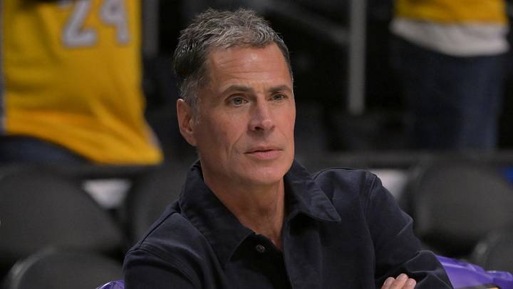 Nov 21, 2024; Los Angeles, California, USA;  Los Angeles Lakers general manager Rob Pelinka, right, talks with Leroy Sims, director of player performance & health, prior to the game against the Orlando Magic at Crypto.com Arena. Mandatory Credit: Jayne Kamin-Oncea-Imagn Images
