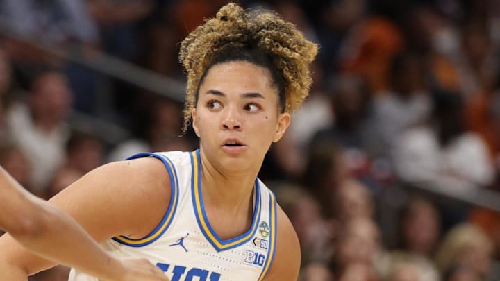 Apr 4, 2025; Tampa, FL, USA;  UCLA Bruins guard Kiki Rice (1) dribbles against Connecticut Huskies guard KK Arnold (2) during first half in a semifinal of the women's 2025 NCAA tournament at Amalie Arena. Mandatory Credit: Nathan Ray Seebeck-Imagn Images