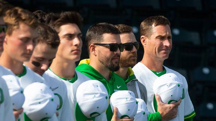 Oregon head baseball coach Mark Wasikowski, right, stands for the National Anthem before the Duck's game against the USC Trojans.
Eug 032522 Uo Baseball 01 Oregon head baseball coach Mark Wasikowski, right, stands for the National Anthem before the Duck's game against the USC Trojans.
Eug 032522 Uo Baseball 01