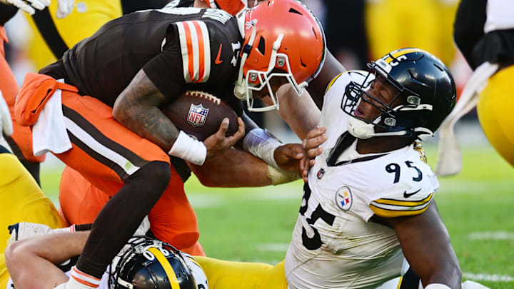 Nov 19, 2023; Cleveland, Ohio, USA; Pittsburgh Steelers linebacker T.J. Watt (90) and defensive tackle Keeanu Benton (95) sack Cleveland Browns quarterback Dorian Thompson-Robinson (17) during the second half at Cleveland Browns Stadium. Mandatory Credit: Ken Blaze-Imagn Images