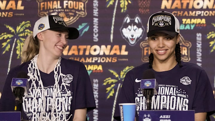 Apr 6, 2025; Tampa, FL, USA; Connecticut Huskies guard Paige Bueckers (5), guard Azzi Fudd (35) and forward Sarah Strong (21) speak to the media after the national championship of the women's 2025 NCAA tournament against the South Carolina Gamecocks at Amalie Arena. Mandatory Credit: Kirby Lee-Imagn Images