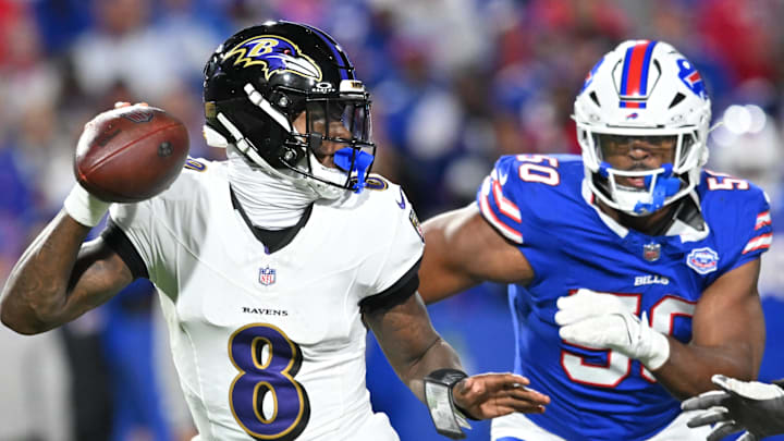 Sep 7, 2025; Orchard Park, New York, USA;  Baltimore Ravens quarterback Lamar Jackson (8) runs the ball during the fourth quarter against the Buffalo Bills at Highmark Stadium. Mandatory Credit: Mark Konezny-Imagn Images