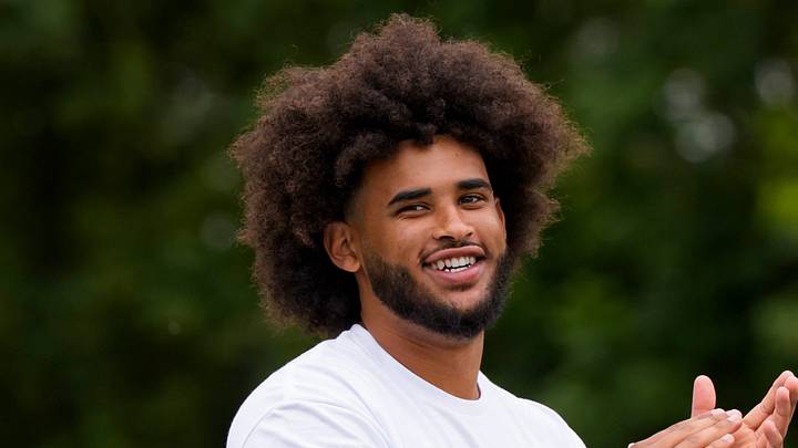 Oregon quarterback Dante Moore celebrates after a reception during a youth football camp at Marist Catholic High School on June 20, 2026, in Eugene, Oregon. Oregon quarterback Dante Moore celebrates after a reception during a youth football camp at Marist Catholic High School on June 20, 2026, in Eugene, Oregon.