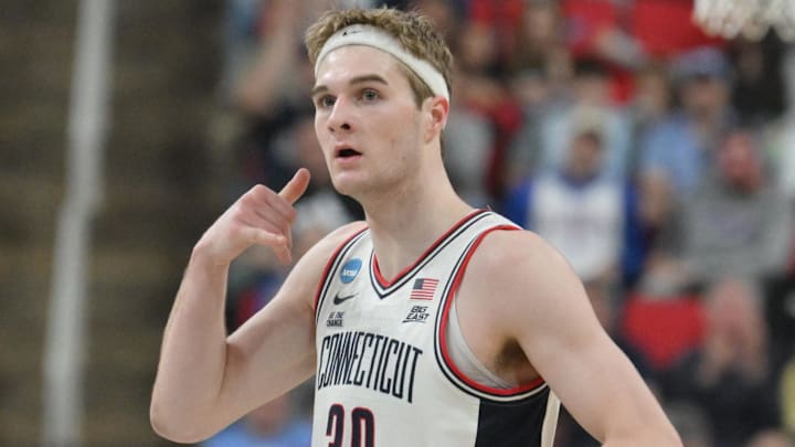 Mar 21, 2025; Raleigh, NC, USA; Connecticut Huskies forward Liam McNeeley (30) reacts during the first half against the Oklahoma Sooners at Lenovo Center. Mandatory Credit: Zachary Taft-Imagn Images Mar 21, 2025; Raleigh, NC, USA; Connecticut Huskies forward Liam McNeeley (30) reacts during the first half against the Oklahoma Sooners at Lenovo Center. Mandatory Credit: Zachary Taft-Imagn Images