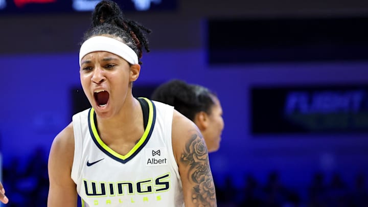 Jul 3, 2025; Arlington, Texas, USA;  Dallas Wings guard Aziaha James (10) celebrates with Dallas Wings forward Myisha Hines-Allen (2) during the second half against the Phoenix Mercury at College Park Center. Mandatory Credit: Kevin Jairaj-Imagn Images