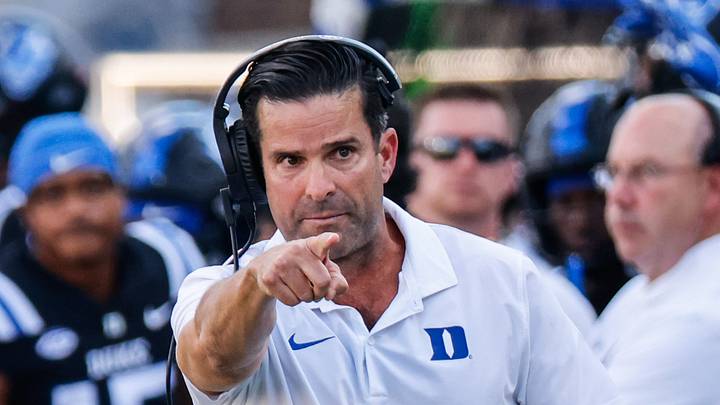 Sep 28, 2024; Durham, North Carolina, USA; Duke Blue Devils head coach Manny Diaz reacts to wide receiver Jordan Moore (8) during the first half of the game against North Carolina Tar Heels at Wallace Wade Stadium. Mandatory Credit: Jaylynn Nash-Imagn Images Sep 28, 2024; Durham, North Carolina, USA; Duke Blue Devils head coach Manny Diaz reacts to wide receiver Jordan Moore (8) during the first half of the game against North Carolina Tar Heels at Wallace Wade Stadium. Mandatory Credit: Jaylynn Nash-Imagn Images