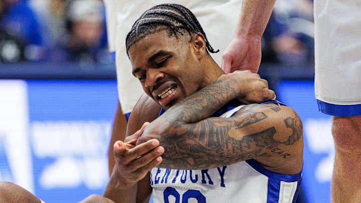 Feb 4, 2026; Lexington, Kentucky, USA; Kentucky Wildcats guard Otega Oweh (00) checks his elbow after getting fouled during the second half against the Oklahoma Sooners at Rupp Arena at Central Bank Center. Mandatory Credit: Jordan Prather-Imagn Images