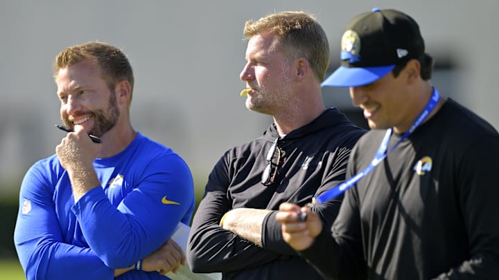 Jul 29, 2024; Los Angeles, CA, USA; Los Angeles Rams head coach Sean McVay, general manager Les Snead and chief of staff Carter Crutchfield talk on the field during training camp at Loyola Marymount University. Mandatory Credit: Jayne Kamin-Oncea-Imagn Images