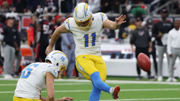 Jan 11, 2025; Houston, Texas, USA; Los Angeles Chargers punter Cameron Dicker (11) completes a 31 yard field goal in the first quarter against the Houston Texans in an AFC wild card game at NRG Stadium. Mandatory Credit: Thomas Shea-Imagn Images