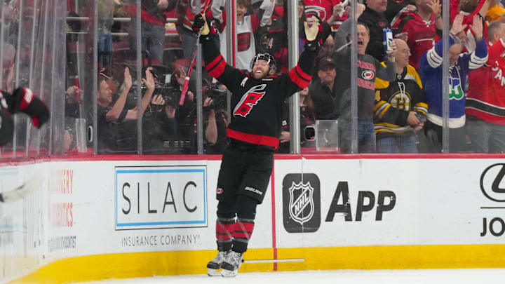 Apr 7, 2026; Raleigh, North Carolina, USA;  Carolina Hurricanes defenseman Jaccob Slavin (74) celebrates his game winning goal in the overtime against the Boston Bruins at Lenovo Center. Mandatory Credit: James Guillory-Imagn Images