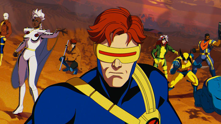 (L-R): Morph (voiced by JP Karliak), Storm (voiced by Alison Sealy-Smith), Gambit (voiced by AJ LoCascio), Cyclops (voiced by Ray Chase), Rogue (voiced by Lenore Zann), Wolverine (voiced by Cal Dodd), Bishop (voiced by Isaac Robinson-Smith), Beast (voiced by George Buza) in Marvel Animation's X-MEN '97. Photo courtesy of Marvel Animation. © 2024 MARVEL.