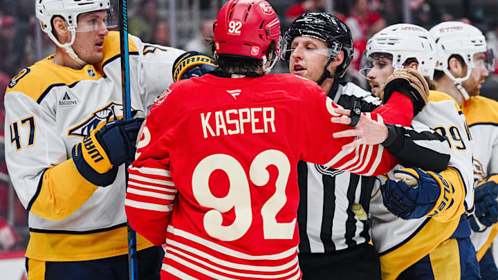 Nov 26, 2025; Detroit, Michigan, USA; Nashville Predators right wing Michael McCarron (47), right wing Ozzy Wiesblatt (89), and Detroit Red Wings center Marco Kasper (92) are broken up during the game at Little Caesars Arena. 