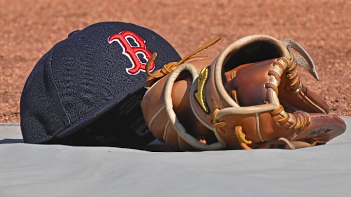 May 10, 2025; Kansas City, Missouri, USA; A general view of a Boston Red Sox's cap and glove on the field before a game against the Kansas City Royals at Kauffman Stadium. Mandatory Credit: Peter Aiken-Imagn Images May 10, 2025; Kansas City, Missouri, USA; A general view of a Boston Red Sox's cap and glove on the field before a game against the Kansas City Royals at Kauffman Stadium. Mandatory Credit: Peter Aiken-Imagn Images