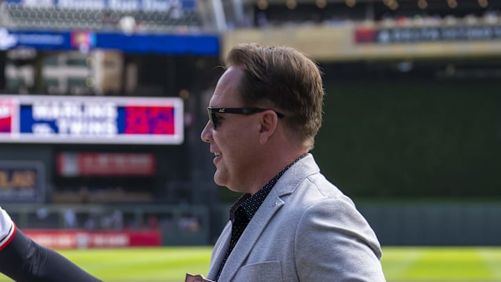 Sep 15, 2024; Minneapolis, Minnesota, USA; Minnesota Twins pitcher Pablo López (49) shakes hands with Minnesota Twins executive President of Baseball Operations Derek Falvey during pre game before a game against the Cincinnati Reds to receive the Roberto Clemente finalist award at Target Field.
