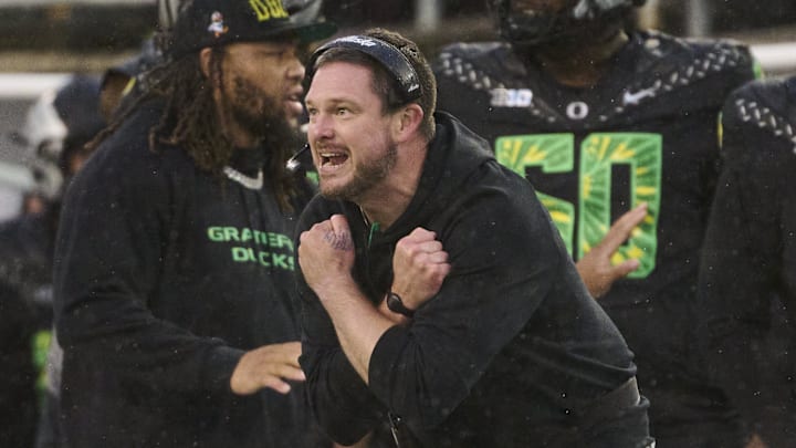 Oct 25, 2025; Eugene, Oregon, USA; Oregon Ducks head coach Dan Lanning instructs players during the first half against the Wisconsin Badgers at Autzen Stadium. Mandatory Credit: Troy Wayrynen-Imagn Images