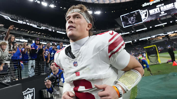 New York Giants quarterback Jaxson Dart (6) runs off the field after the game against the Las Vegas Raiders at Allegiant Stadium.  