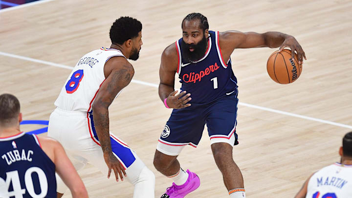 Los Angeles Clippers guard James Harden (1) against Philadelphia 76ers forward Paul George (8) during the first half at Intuit Dome. 