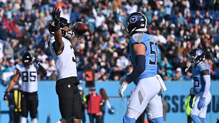 Nov 30, 2025; Nashville, Tennessee, USA; Jacksonville Jaguars wide receiver Jakobi Meyers (3) celebrate a touchdown catch as Tennessee Titans linebacker Cody Barton (50) looks on during the first half at Nissan Stadium. Mandatory Credit: Steve Roberts-Imagn Images
