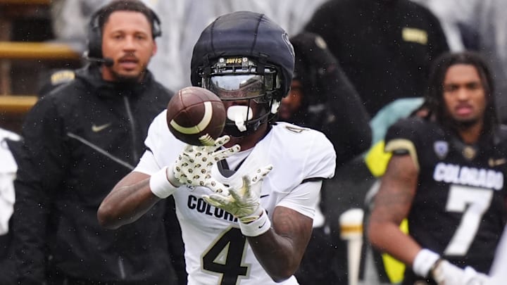 Apr 27, 2024; Boulder, CO, USA; Colorado Buffaloes wide receiver Omarion Miller (4) prepares to catch the ball during a spring game event at Folsom Field. Mandatory Credit: Ron Chenoy-Imagn Images