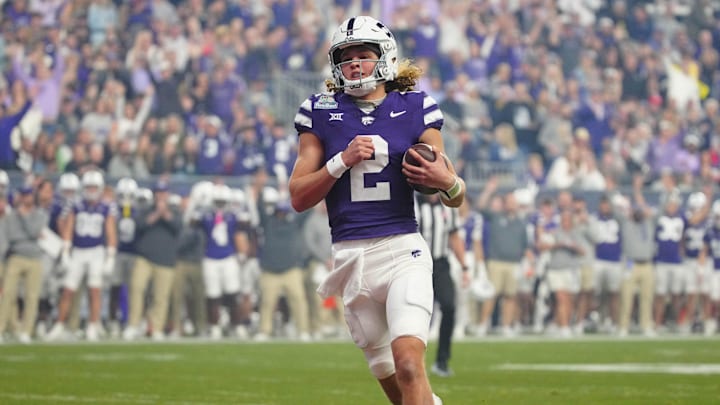 Kansas State quarterback Avery Johnson (2) scores a touchdown against Rutgers during first half of the Rate Bowl at Chase Field on Dec. 26, 2024, in Phoenix.