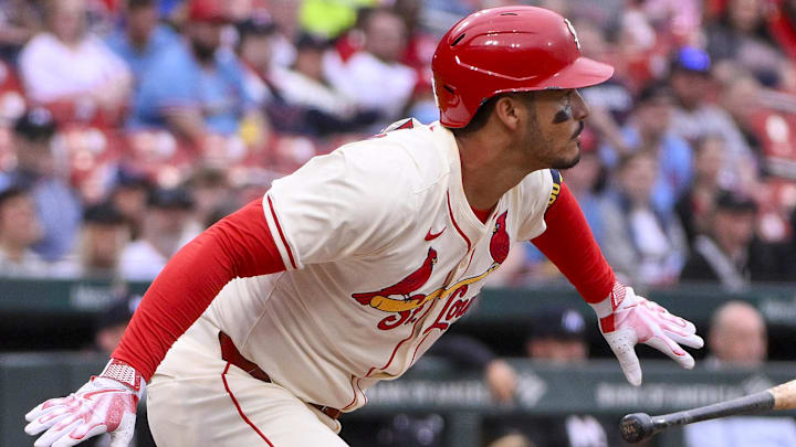 Mar 29, 2025; St. Louis, Missouri, USA;  St. Louis Cardinals third baseman Nolan Arenado (28) hits a one run single against the Minnesota Twins during the first inning at Busch Stadium. 