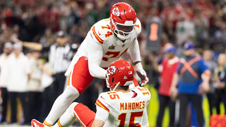 Feb 9, 2025; New Orleans, LA, USA;  Kansas City Chiefs offensive tackle Jawaan Taylor (74) helps up quarterback Patrick Mahomes (15) against the Philadelphia Eagles in Super Bowl LIX at Ceasars Superdome. Mandatory Credit: Mark J. Rebilas-Imagn Images