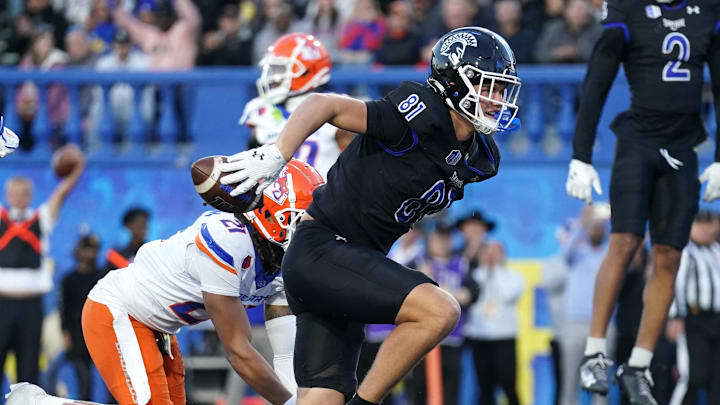 Nov 16, 2024; San Jose, California, USA; San Jose State Spartans tight end Jacob Stewart (81) regains his footing after catching a touchdown in front of Boise State Broncos safety Zion Washington (21) in the second quarter at CEFCU Stadium. Mandatory Credit: Cary Edmondson-Imagn Images