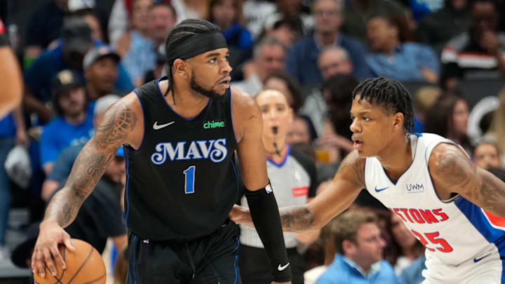 Apr 12, 2024; Dallas, Texas, USA; Dallas Mavericks guard Jaden Hardy (1) controls the bal as Detroit Pistons guard Marcus Sasser (25) defends during the second half at American Airlines Center. Mandatory Credit: Chris Jones-Imagn Images