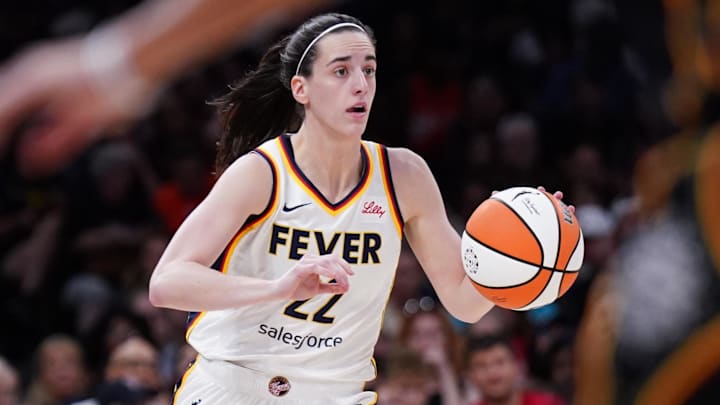 Jul 15, 2025; Boston, Massachusetts, USA; Indiana Fever guard Caitlin Clark (22) returns the ball against the Connecticut Sun in the second quarter at TD Garden. Mandatory Credit: David Butler II-Imagn Images