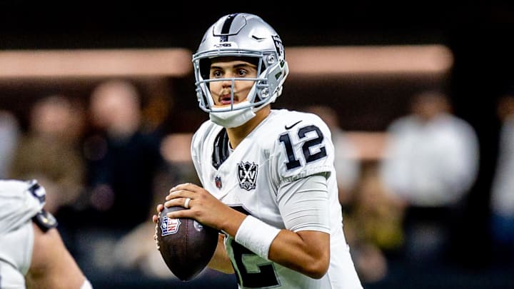Dec 29, 2024; New Orleans, Louisiana, USA;  Las Vegas Raiders quarterback Aidan O'Connell (12) looks on against the New Orleans Saints during the second half at Caesars Superdome. Mandatory Credit: Stephen Lew-Imagn Images