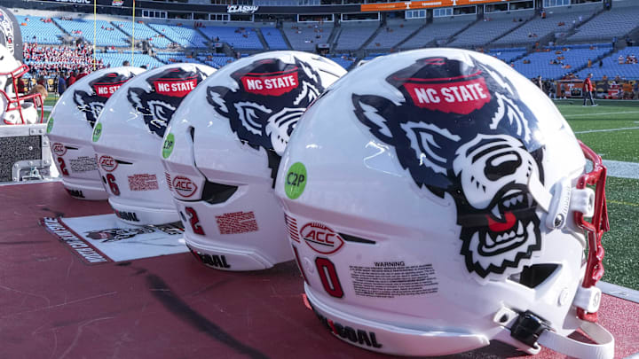 Sep 7, 2024; Charlotte, North Carolina, USA; North Carolina State Wolfpack helmets during pregame activity for the Dukes Mayo Classic against the Tennessee Volunteers at Bank of America Stadium. Mandatory Credit: Jim Dedmon-Imagn Images