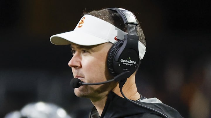 Nov 2, 2024; Seattle, Washington, USA; USC Trojans head coach Lincoln Riley stands on the sideline during the fourth quarter against the Washington Huskies at Alaska Airlines Field at Husky Stadium. Mandatory Credit: Joe Nicholson-Imagn Images Nov 2, 2024; Seattle, Washington, USA; USC Trojans head coach Lincoln Riley stands on the sideline during the fourth quarter against the Washington Huskies at Alaska Airlines Field at Husky Stadium. Mandatory Credit: Joe Nicholson-Imagn Images