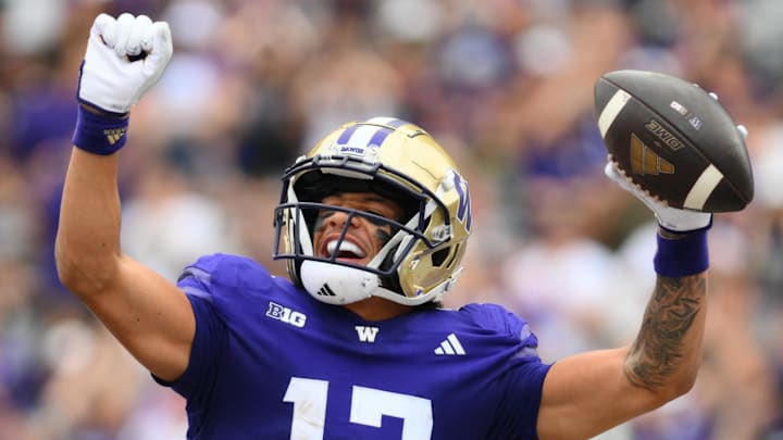 Sep 7, 2024; Seattle, Washington, USA; Washington Huskies wide receiver Denzel Boston (12) celebrates after catching a pass for a touchdown against the Eastern Michigan Eagles during the first half at Alaska Airlines Field at Husky Stadium. Mandatory Credit: Steven Bisig-Imagn Images